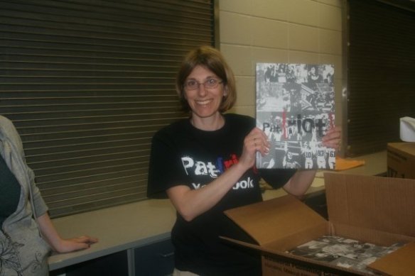 Christine with the final high school yearbook she oversaw from a few years back.